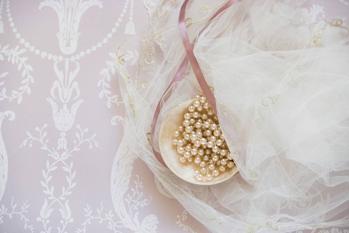 Bride wearing elegant pearl hair bands for wedding updo